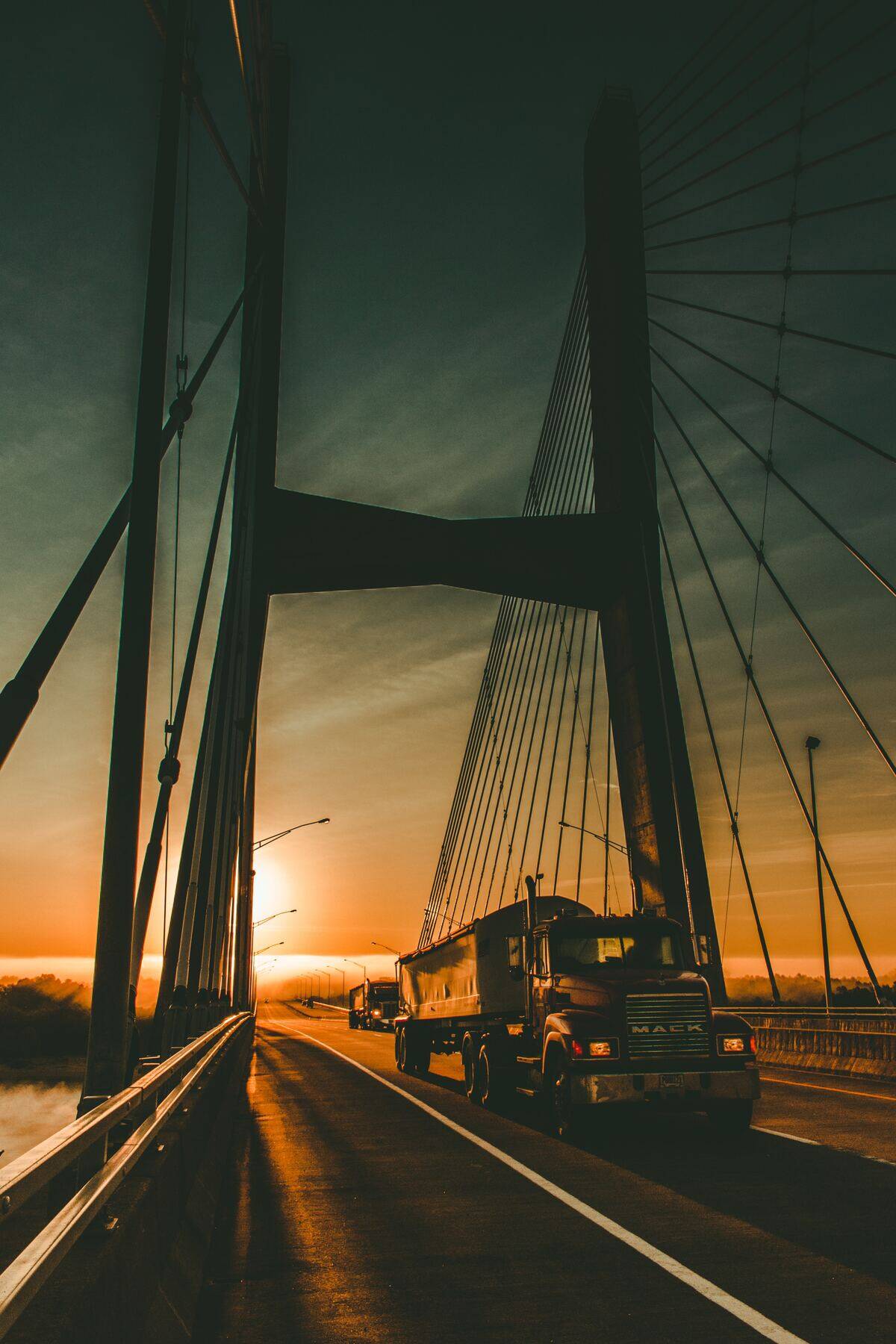 Truck driving across a bridge
