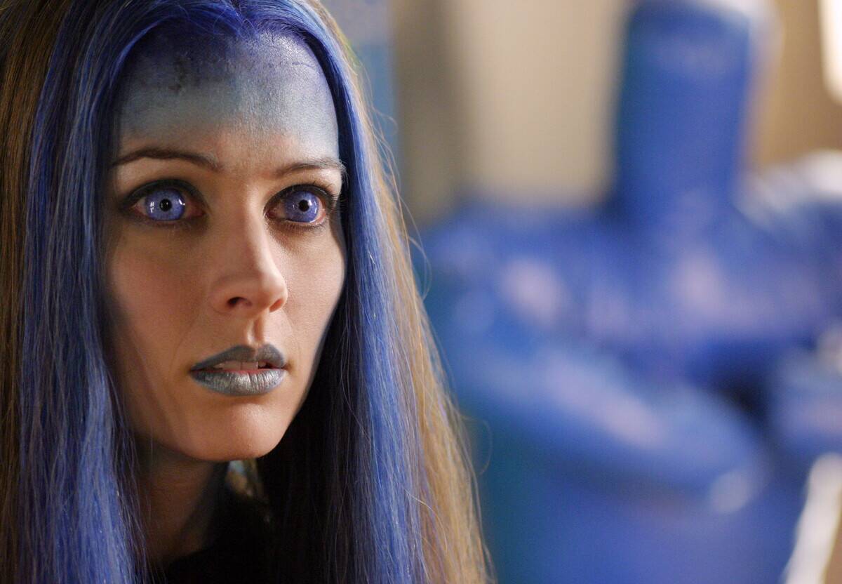girl with purple makeup and hair in angel