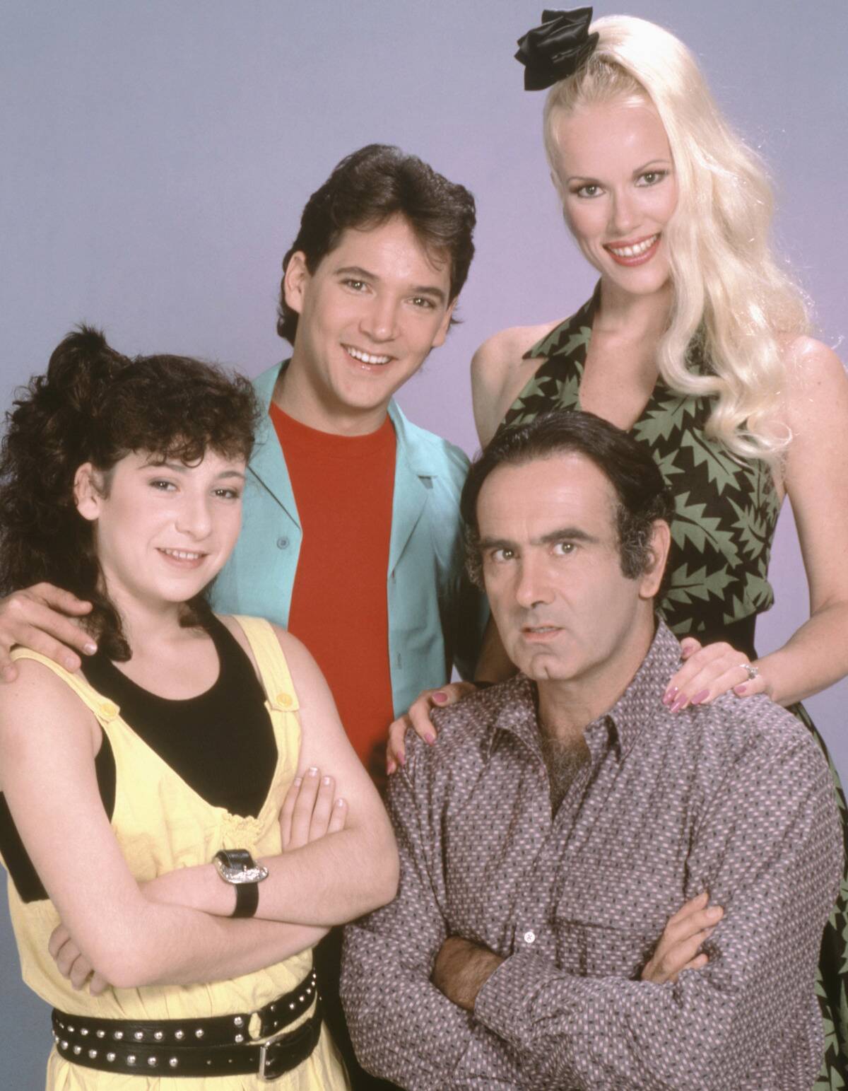 cast of the tortellis with purple background