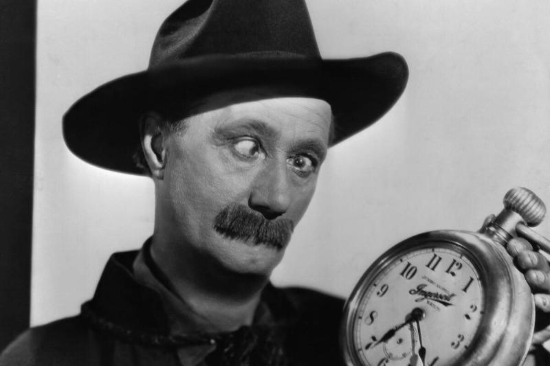Ben Turpin Holding a Clock