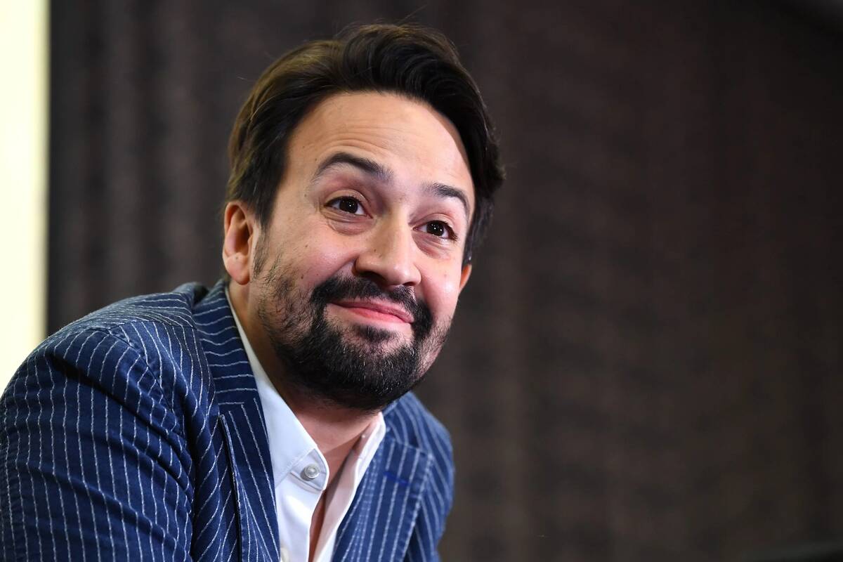 Lin-Manuel Miranda smiling for a photo