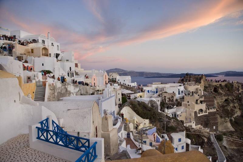 Greece - Santorini - Tourists watching the sunset in Oia