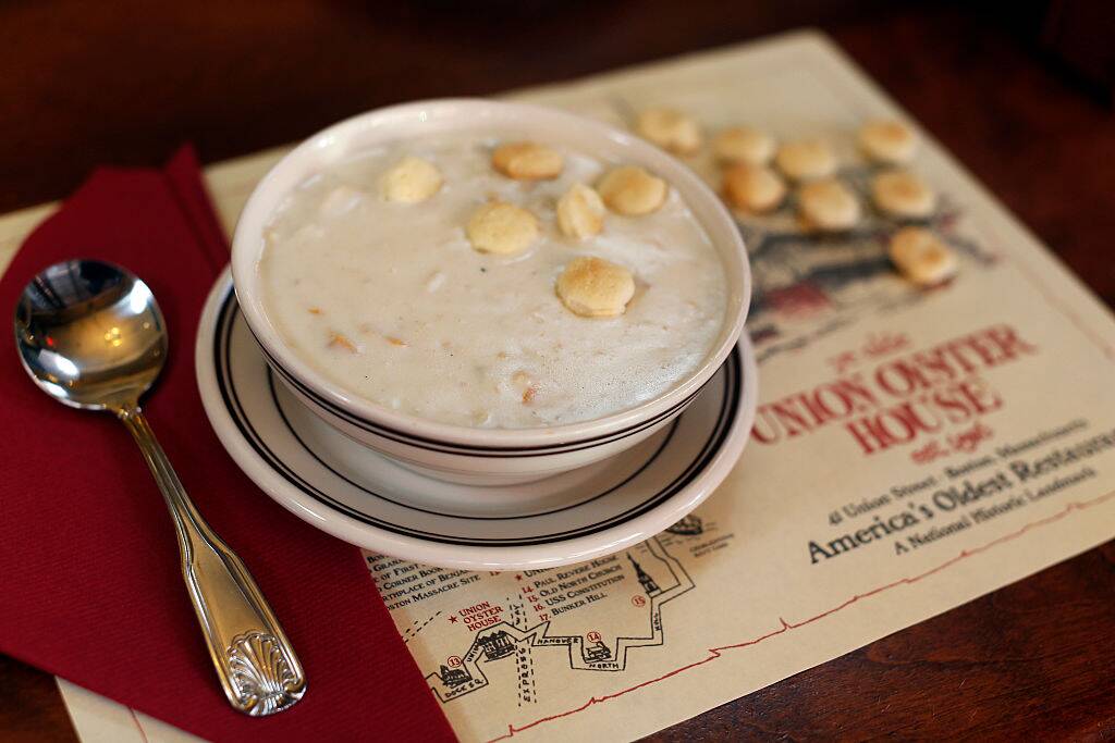 clam chowder in a bowl with oyster crackers