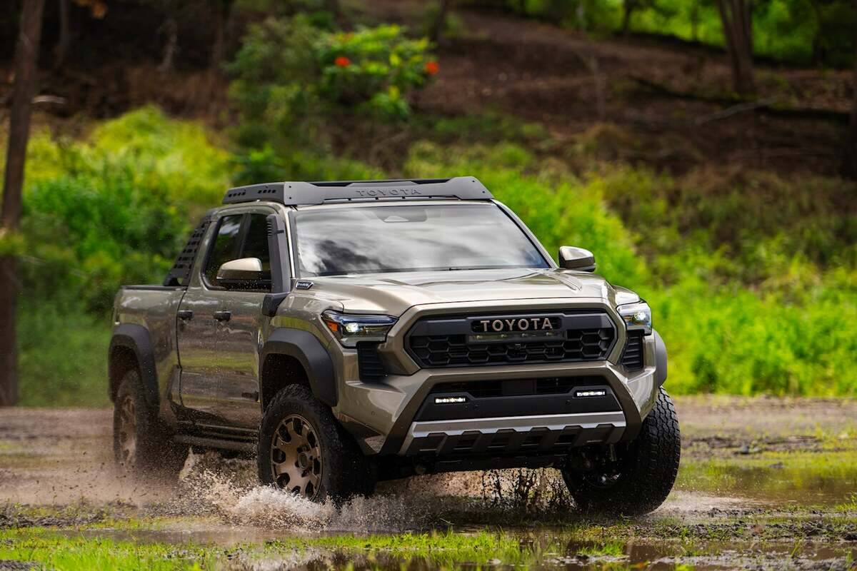 2024-toyota-tacoma-driving-front-angle-carbuzz-1138154-1600