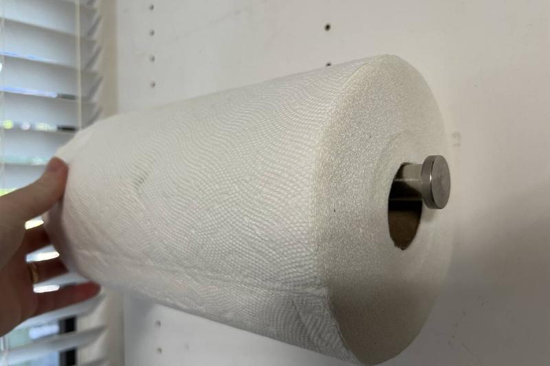 Hand On Paper Towel Roll