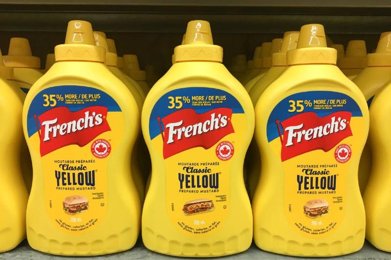 Yellow plastic squeeze bottles of French's mustard sauce...