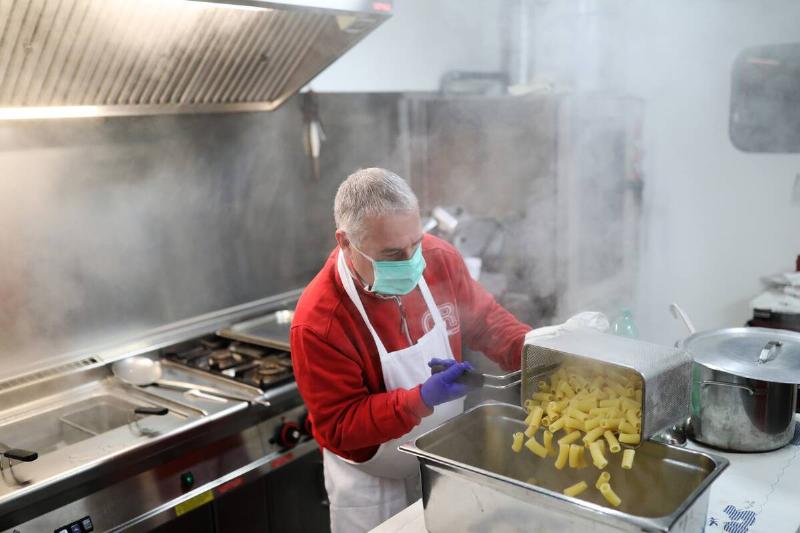 Italian Red Cross Makes Meals For Rome's Homeless During Coronavirus Lockdown
