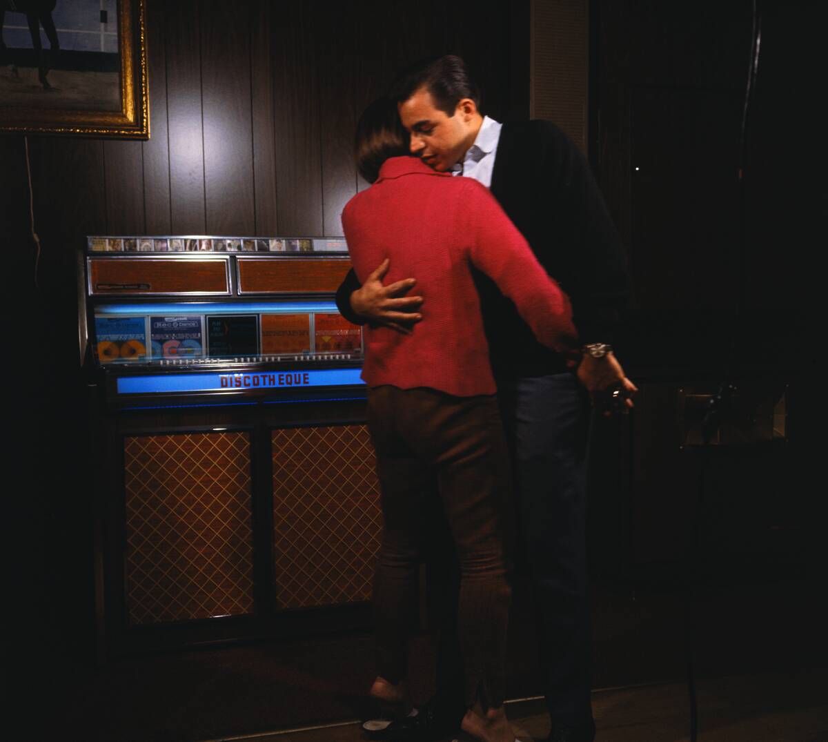 Couple Slow Dancing Near Jukebox