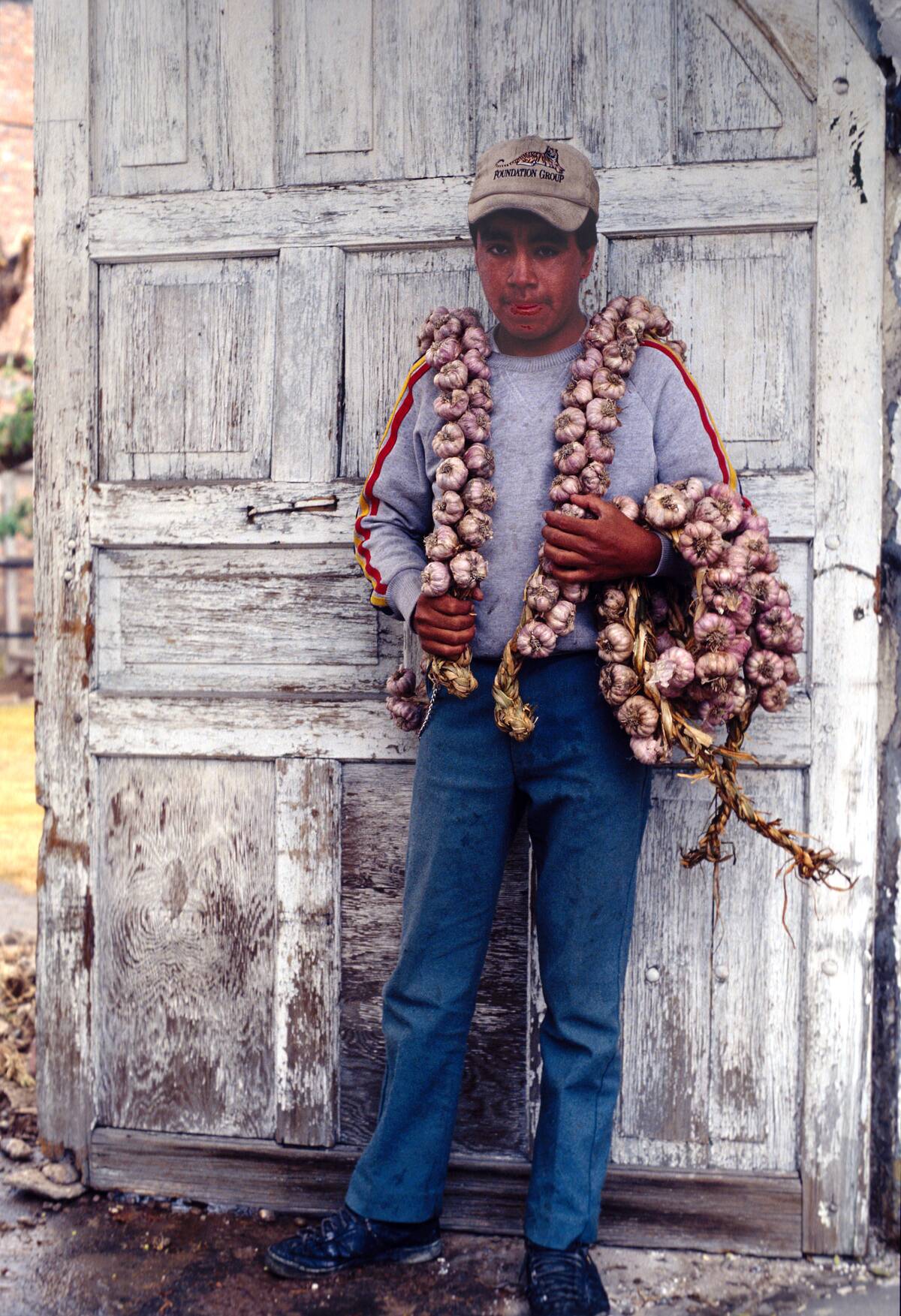 Teen Boy Sells Garlic Wreaths