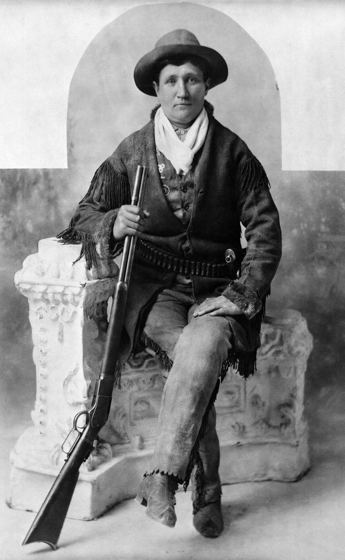 Calamity Jane Seated With Rifle