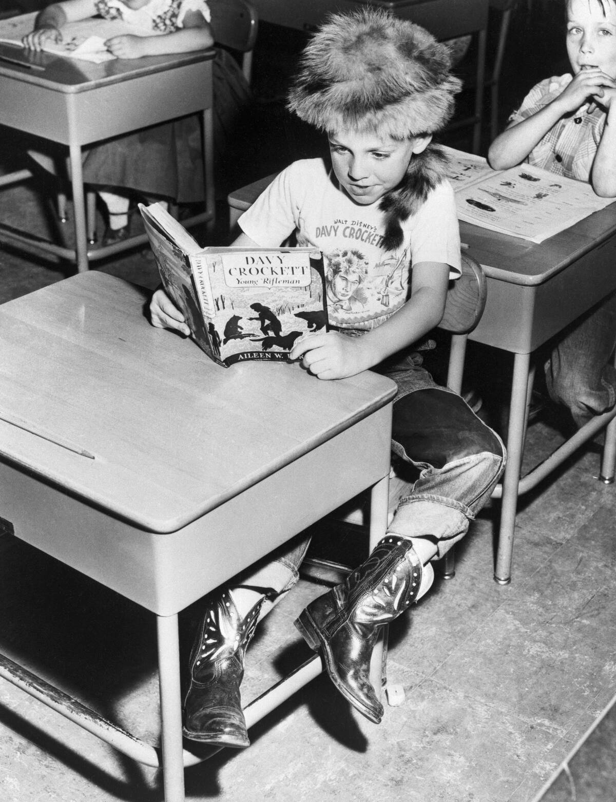 Child Reading about Davy Crockett