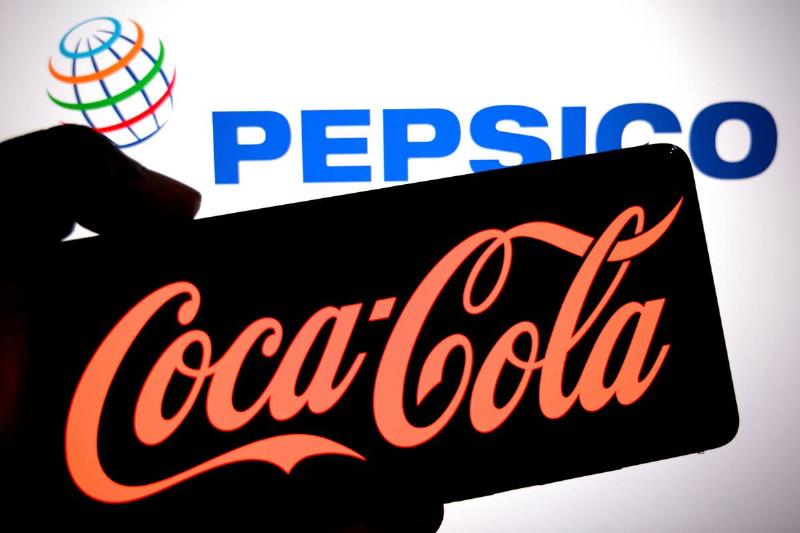 In this photo illustration, a Coca cola logo is seen...