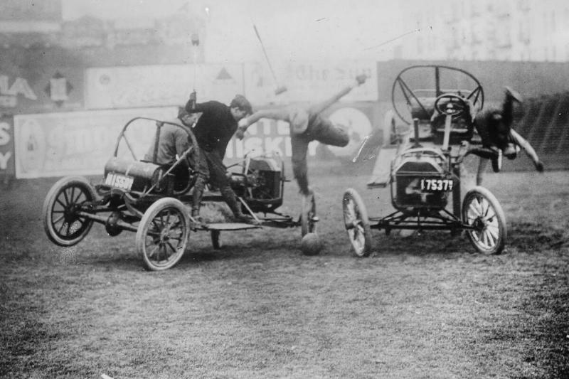 Instead of Horses, Cars carry mallet wielding Competitors in a Game of Polo