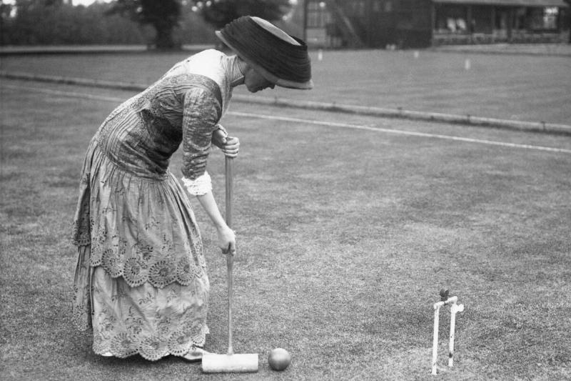 Well Dressed Lady Playing Croquet
