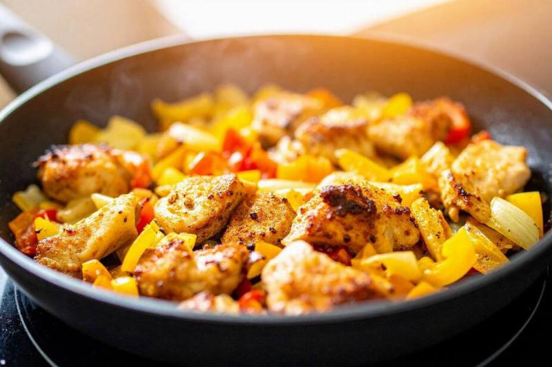 Frying pan filled with various types of food