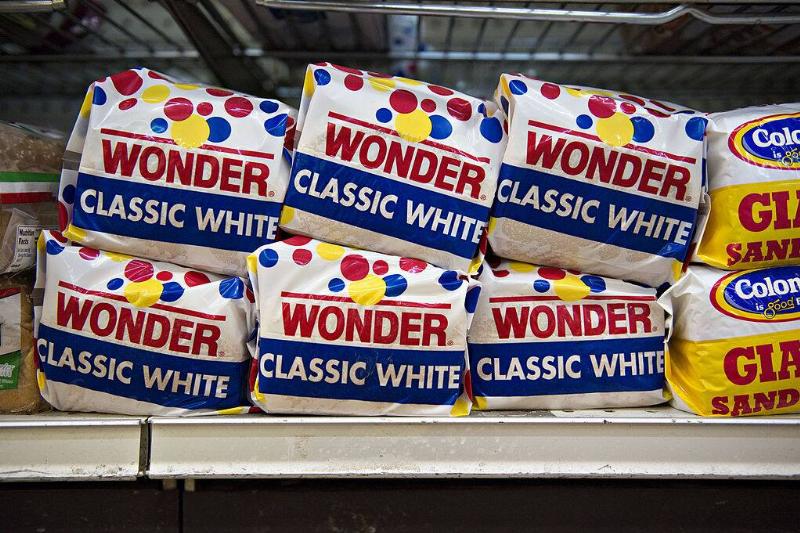 Loaves of 'Classic White' Wonder bread on a store shelf