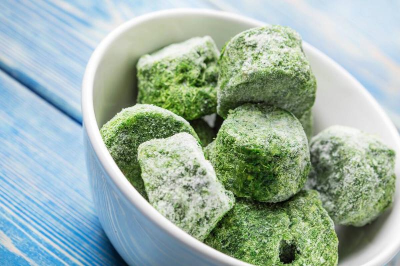 Bowl of frozen spinach cubes
