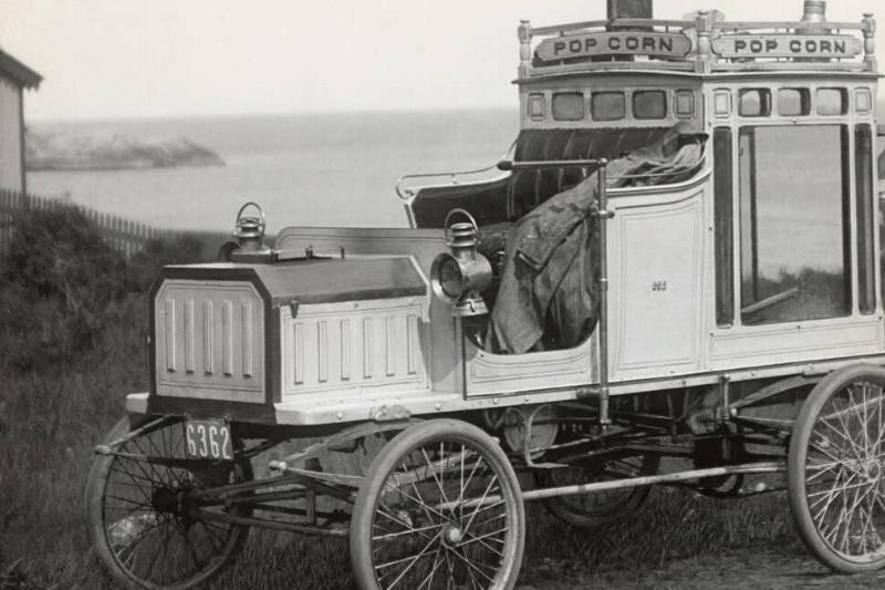 portrait-of-early-popcorn-vendor-next-to-his-automobile-79388