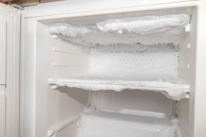 Freezer shelves covered in ice