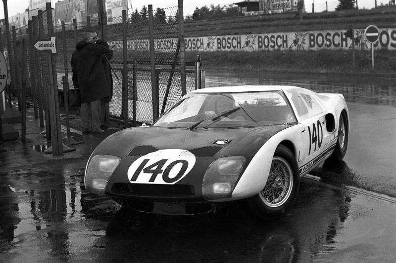 Bruce McLaren driving a Ford GT40 on a race track