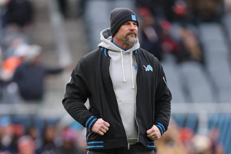Dan Campbell standing in the middle of a football stadium