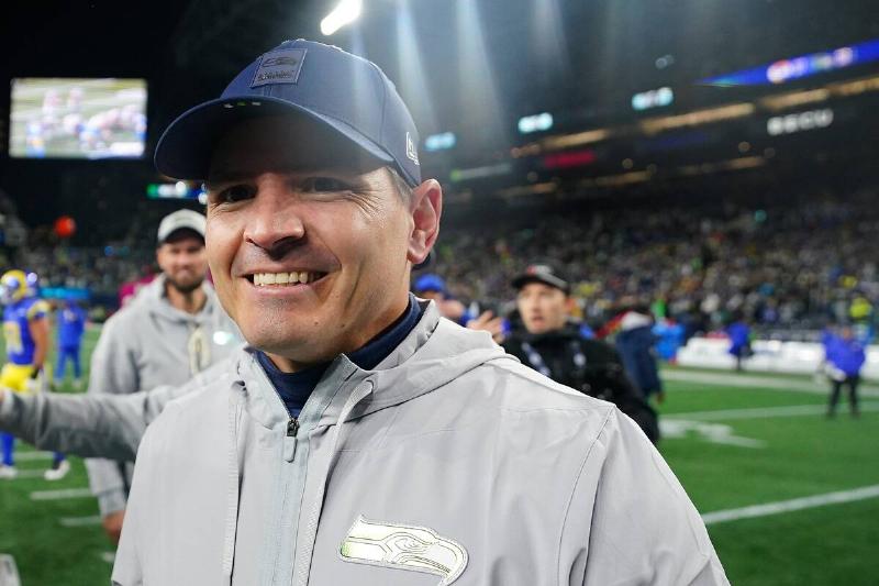 Mike Macdonald standing in a football stadium