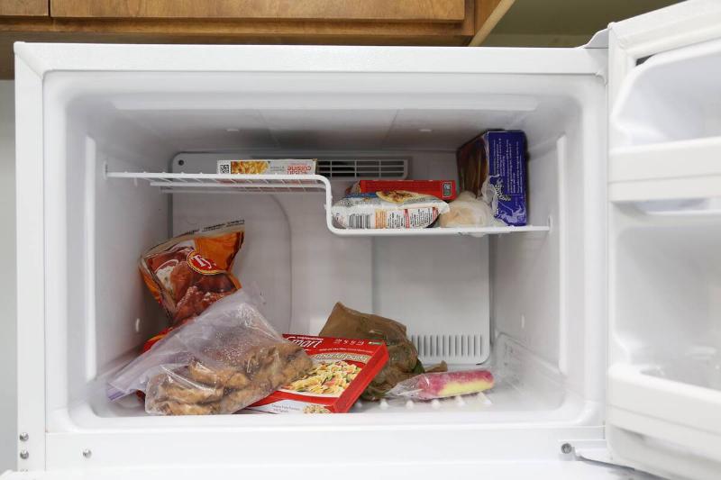 Bags and boxes of food in a freezer