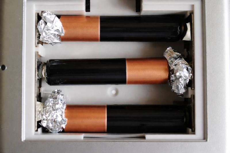 AI rendering of three batteries in a product, with aluminum foil between the positive side of each and the wall