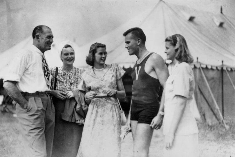 Kelly family standing in front of a tent