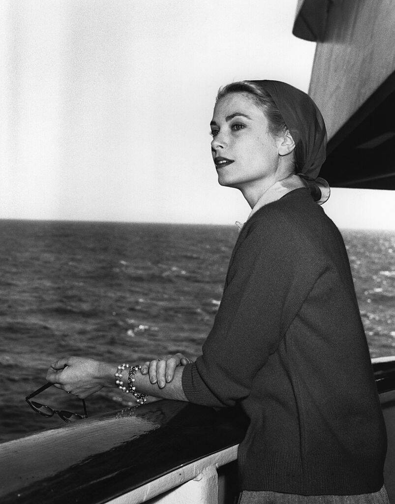 Grace Kelly looking out at sea while aboard the ocean liner Constitution