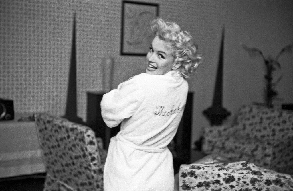 Marilyn Monroe standing in a bathrobe