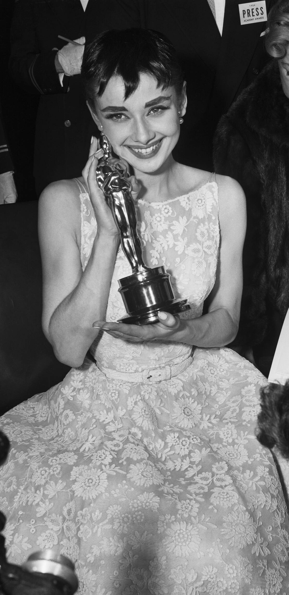 Audrey Hepburn holding her Oscar