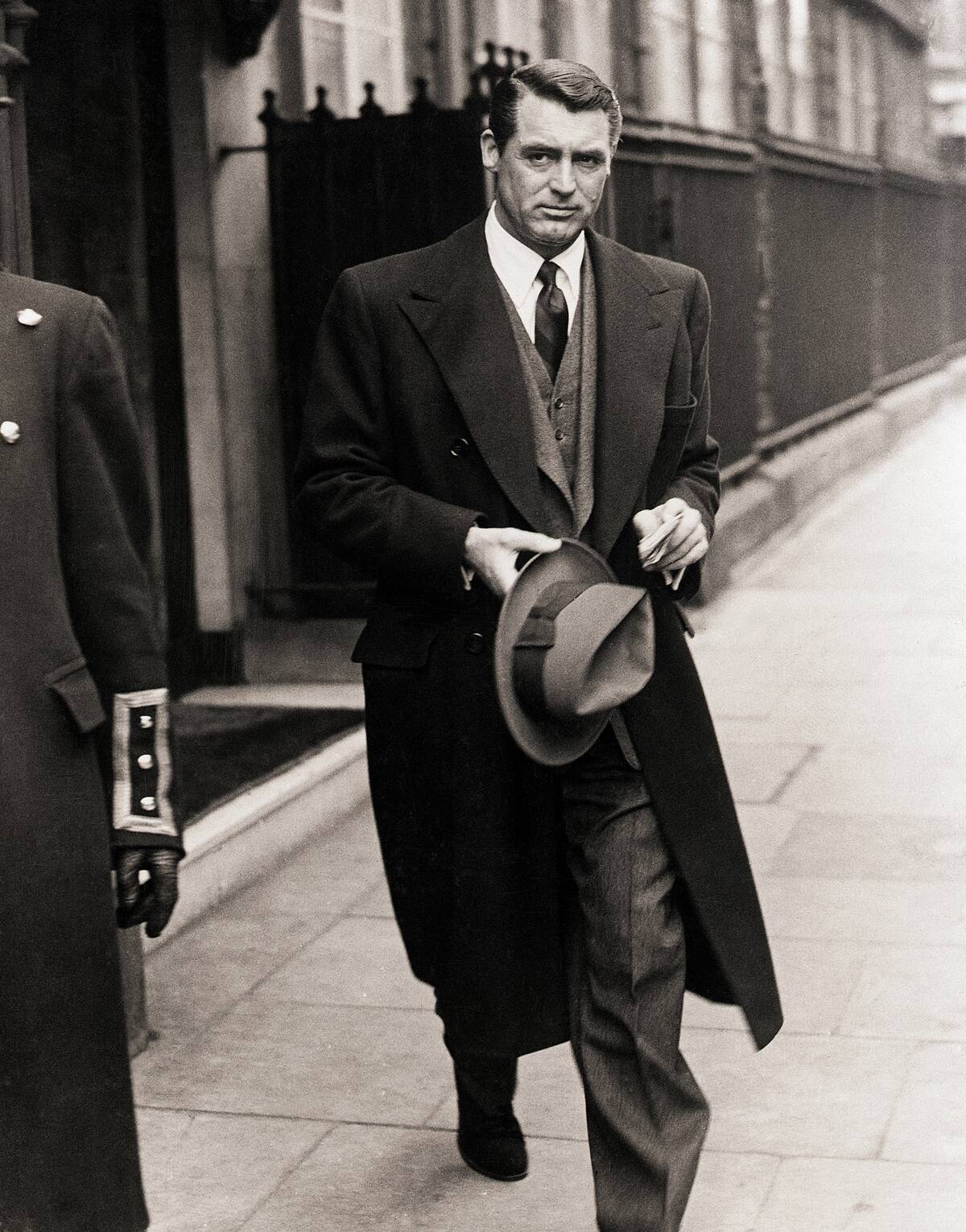 Cary Grant walking down a street
