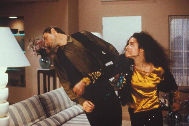 Julia Louis-Dreyfus and Nicholas Guest as Margo and Todd Chester in 'Christmas Vacation'