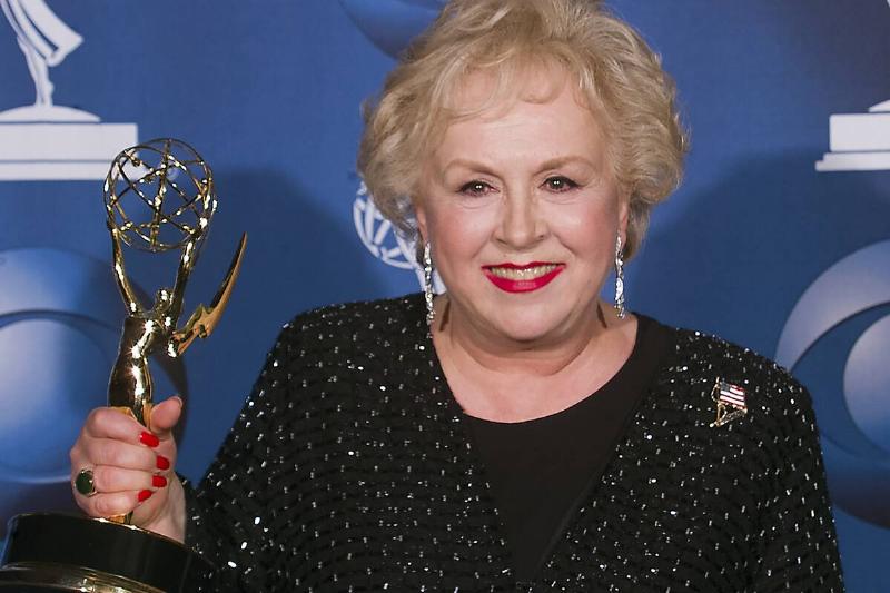Doris Roberts holding an Emmy