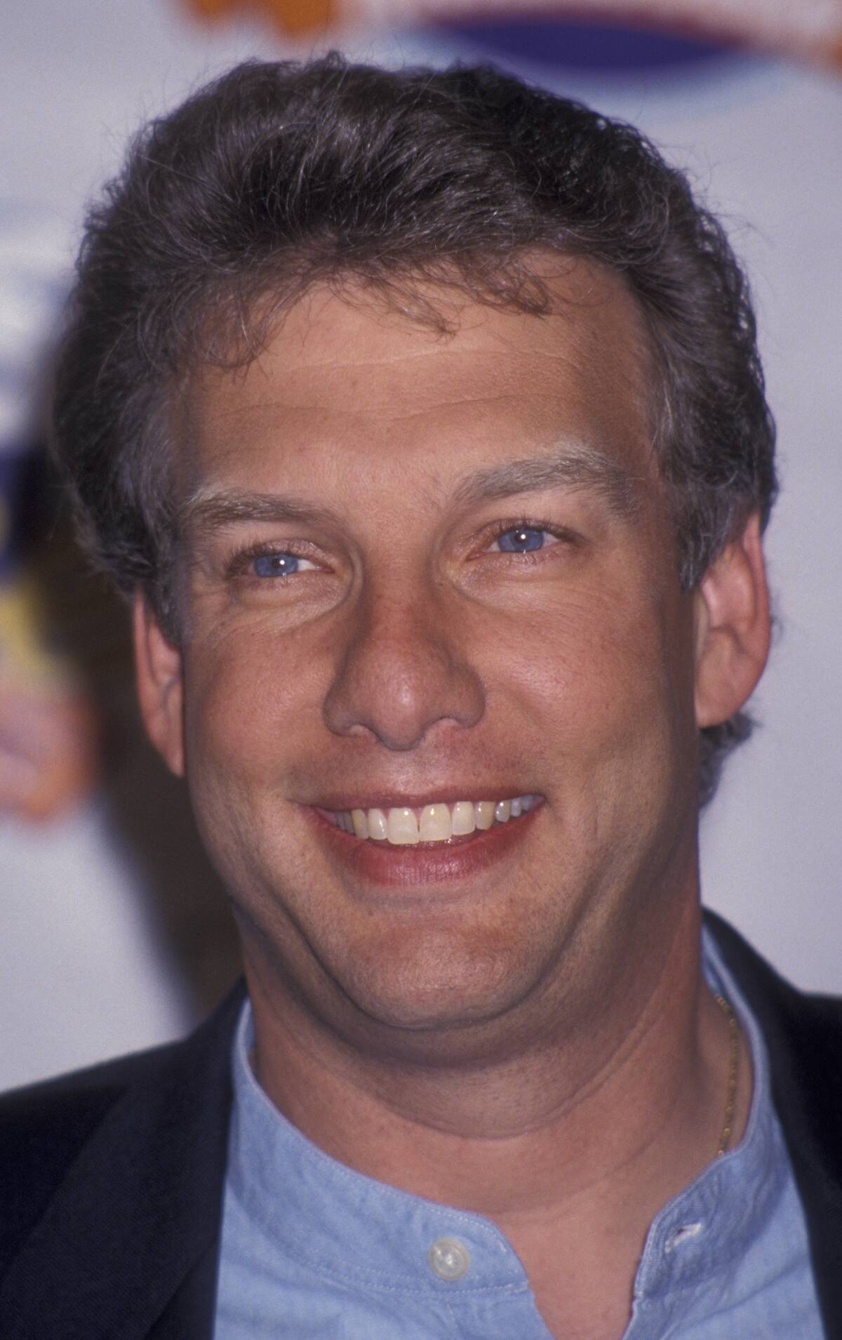 Marc Summers standing on a red carpet