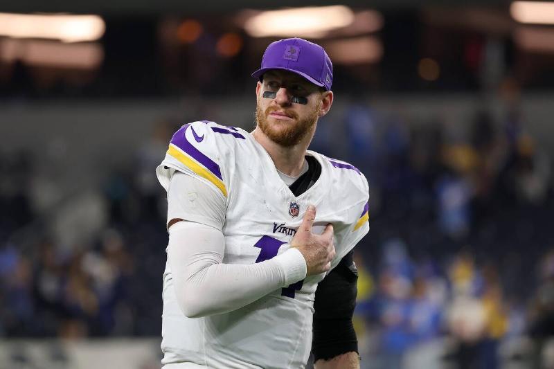 Carson Wentz holding his hand over his chest