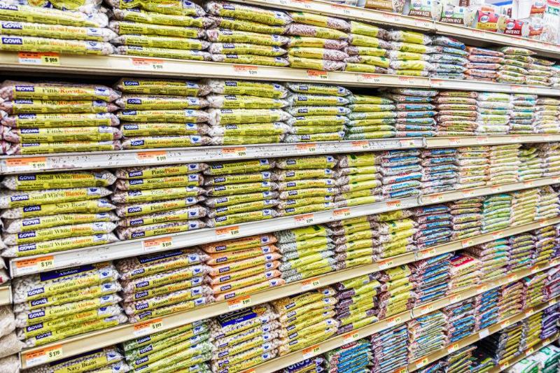 Bags of dried beans on a store shelf