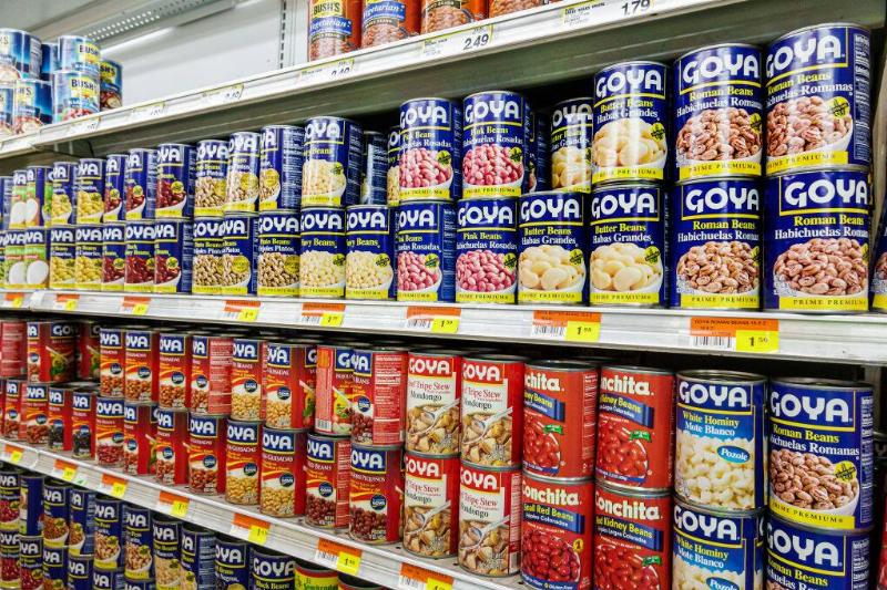 Cans of beans on grocery store shelves
