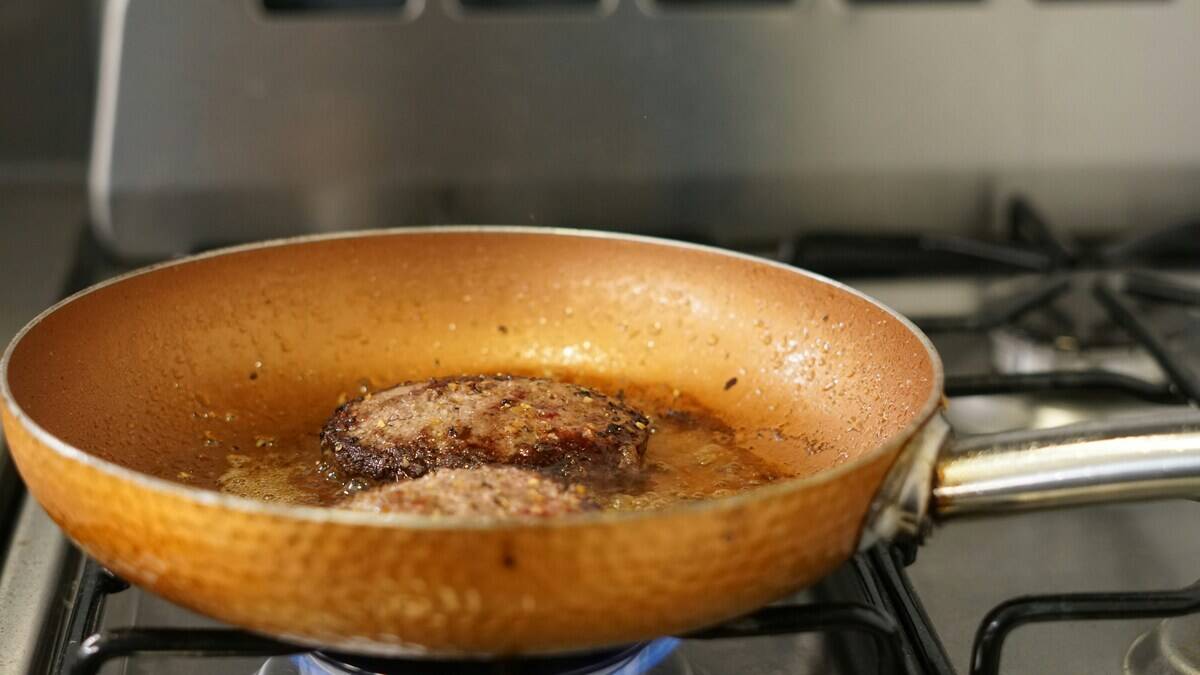 Meat cooking in a frying pan