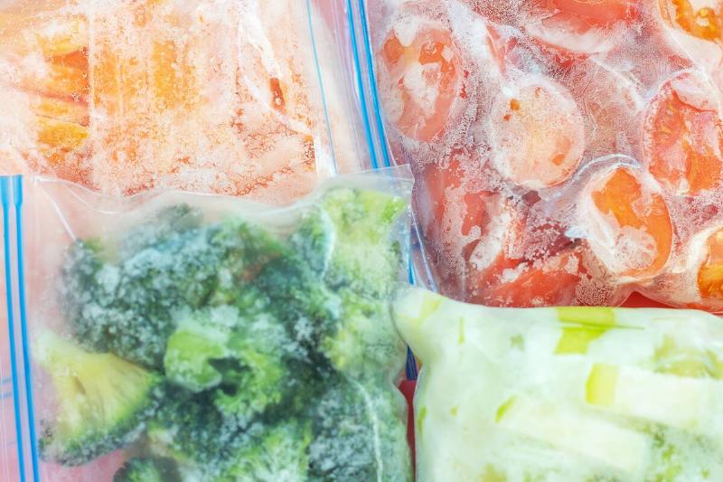 Bags of frozen food in a freezer