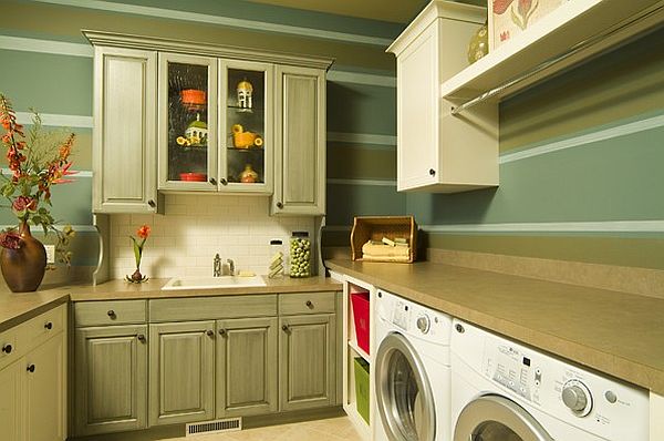 Green laundry room with traditional cabinets