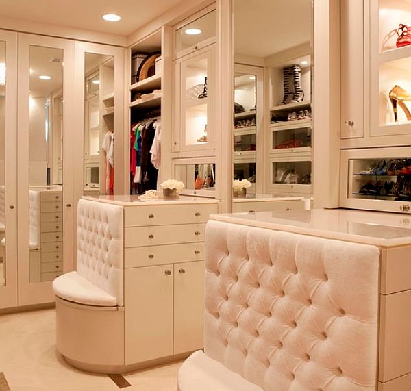perfect walk-in closet with bench and drawers