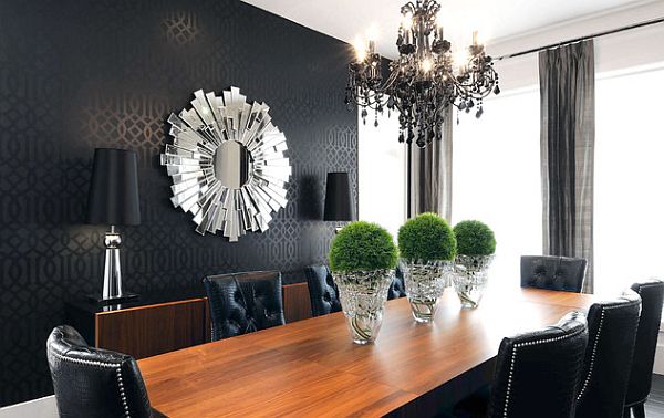 black themed living room with sunburst mirror