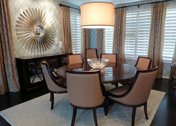 glamorous dining room with sunburst mirror
