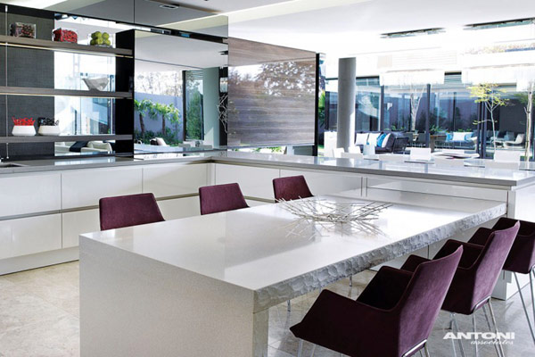 Opulent modern home in Houghton – modern kitchen decor with white table and purple chairs