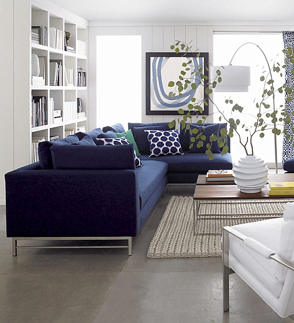 A sectional sofa with a stainless steel base