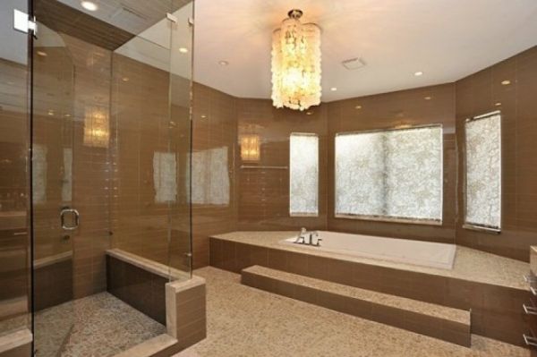 This traditional bathroom features an incredible sunken bathtub and spacious shower.