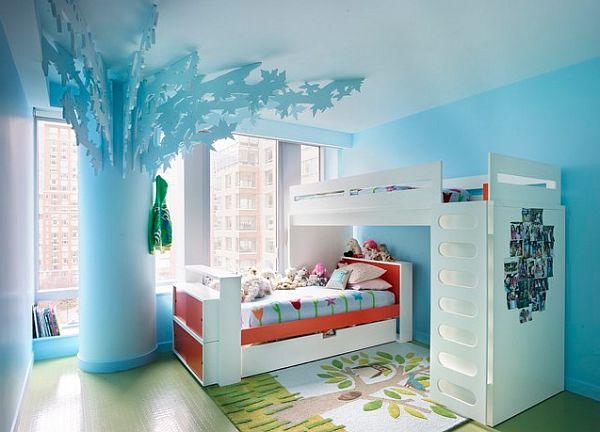 Blue kids bedroom with bunk beds and tree
