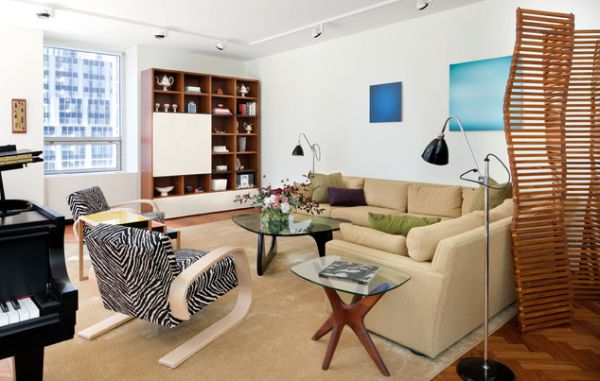 Modern Condo in white employs trac lighting to bring in a light and airy appeal